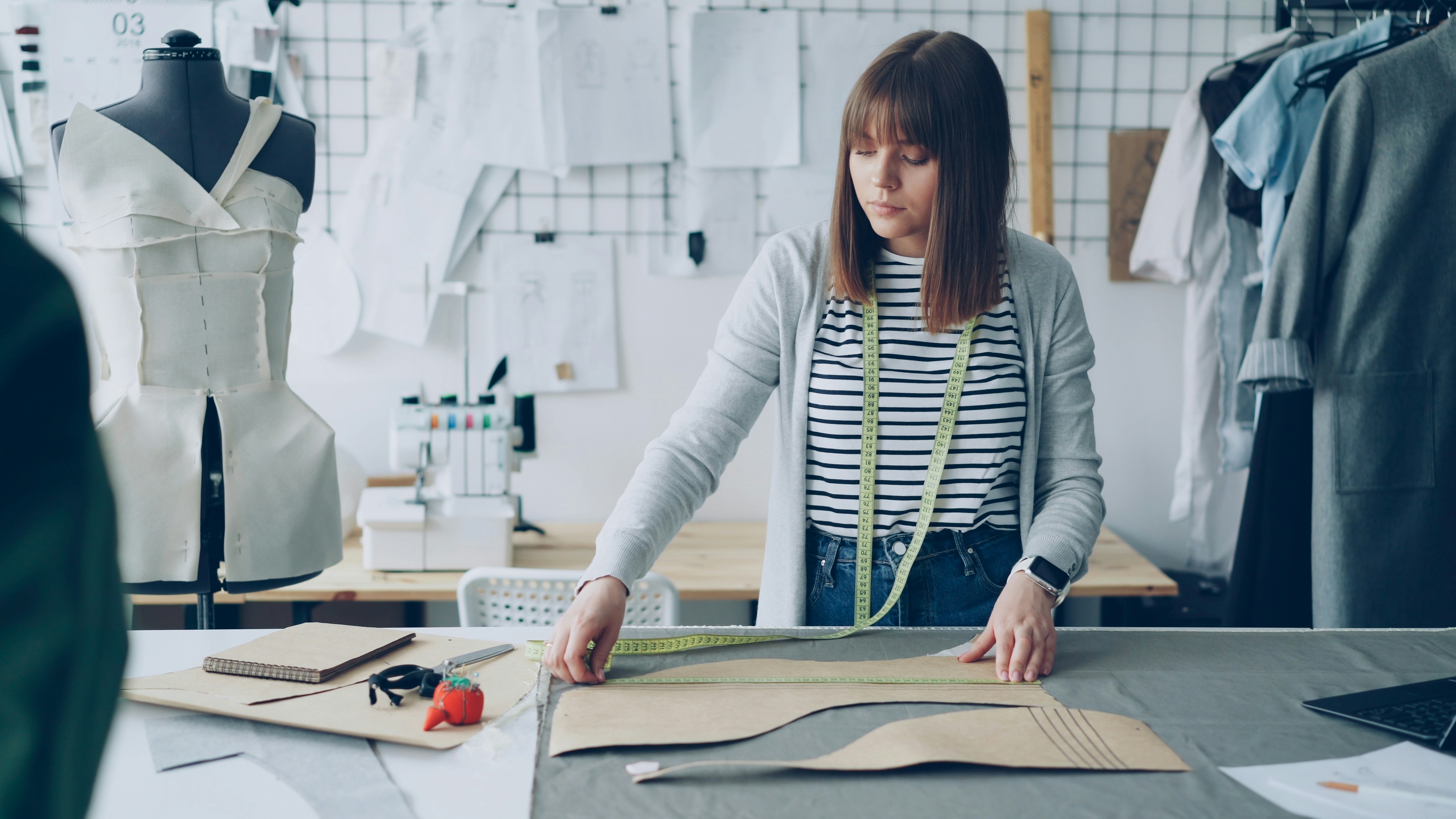 A fashion designer works in her creative studio.