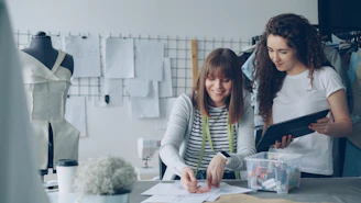 Designers collaborating and working in a studio.