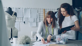 Designers collaborating and working in a studio.