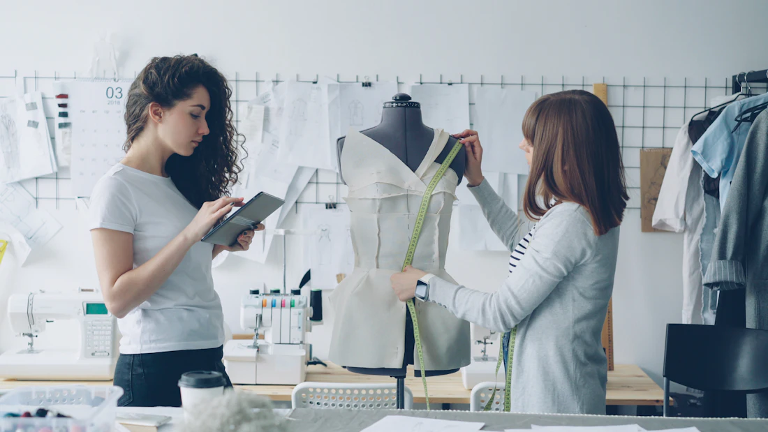Designers reviewing a garment together in the studio