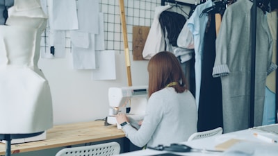 A seamstress is working in her fashion studio.