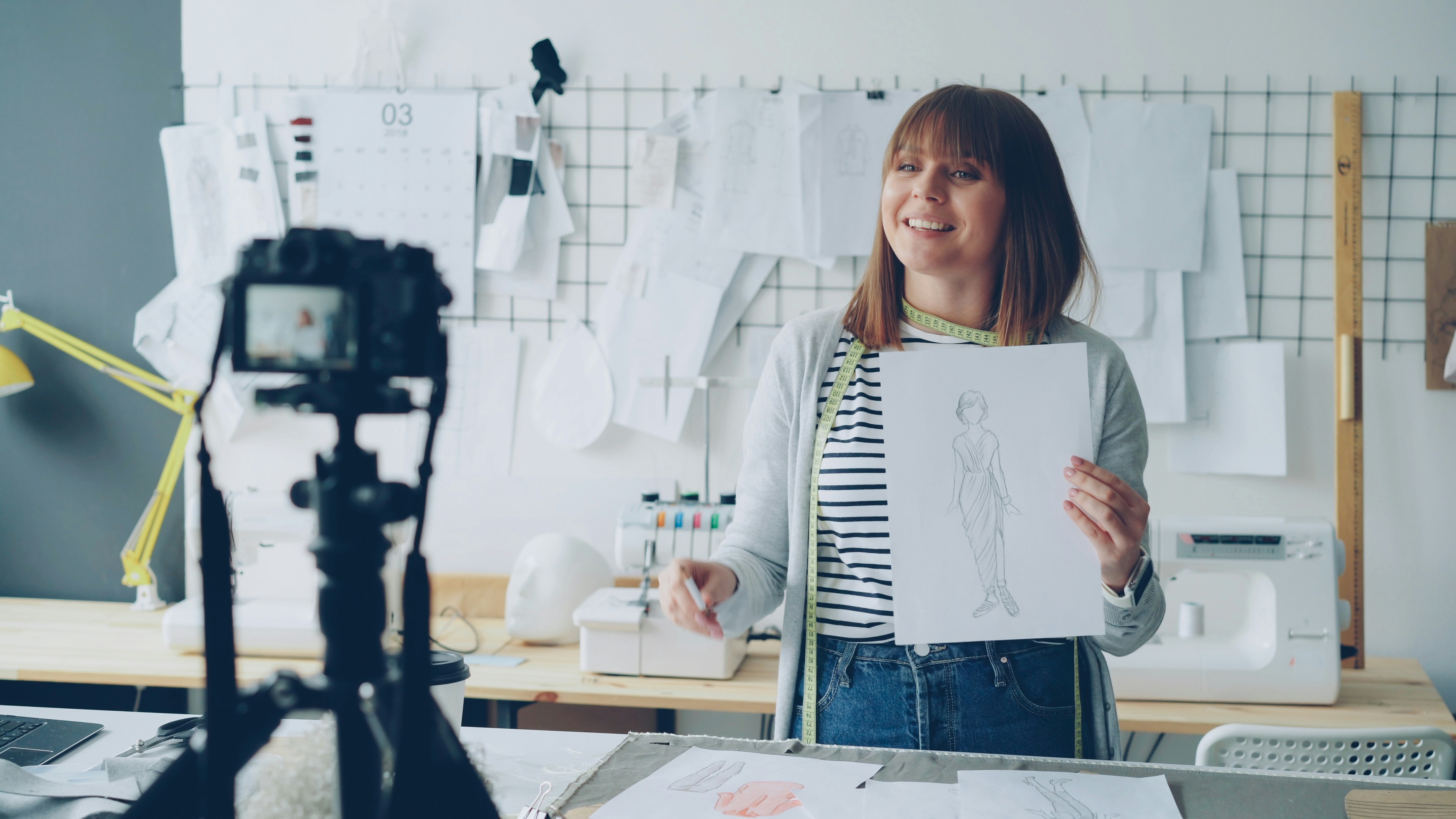 Woman is recording a video about fashion design.