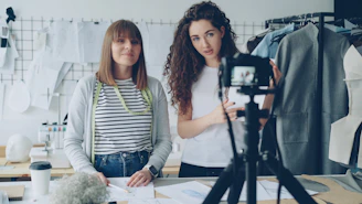 Two women are filming a video about fashion.