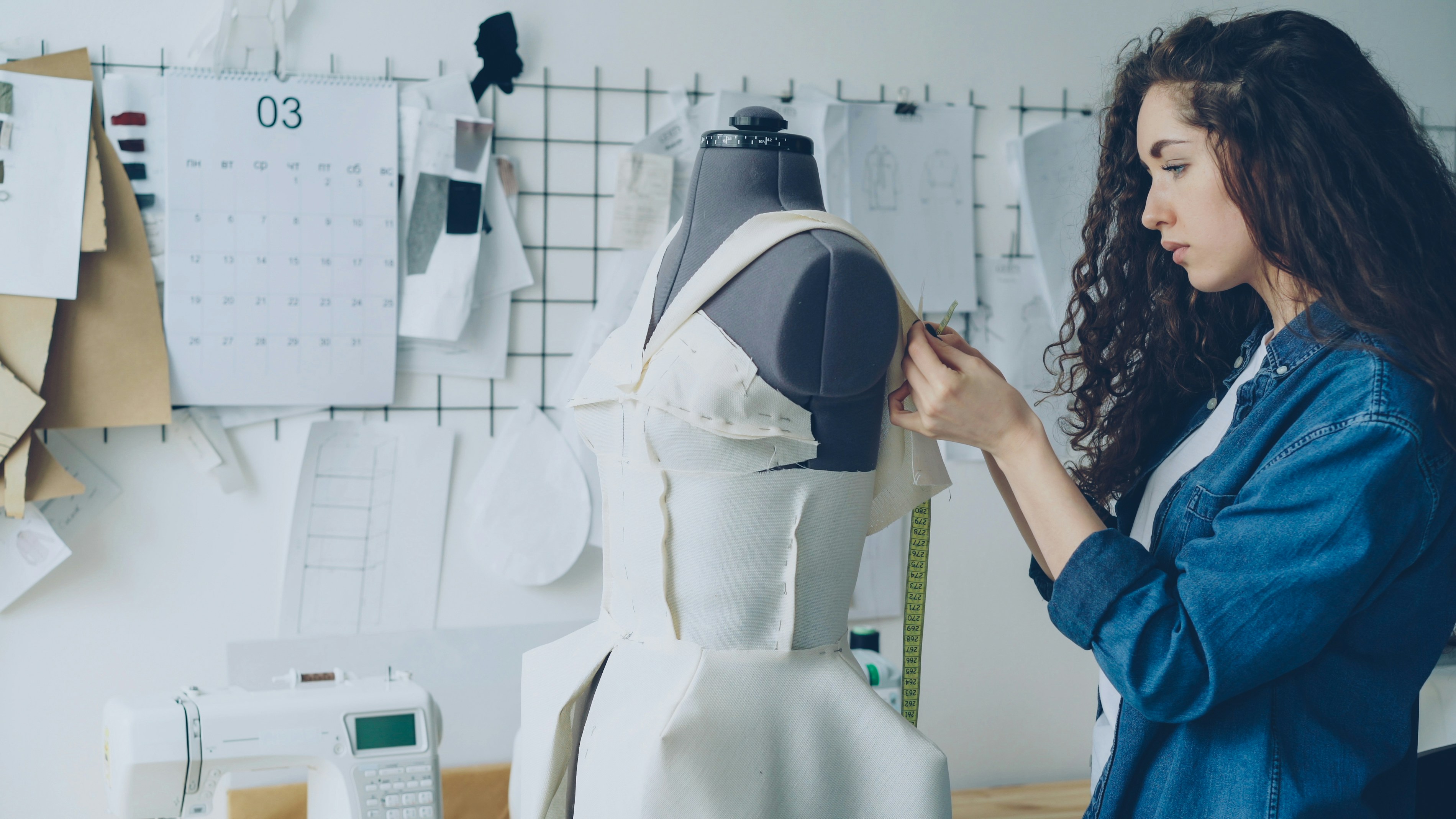 Tailor adjusting clothes