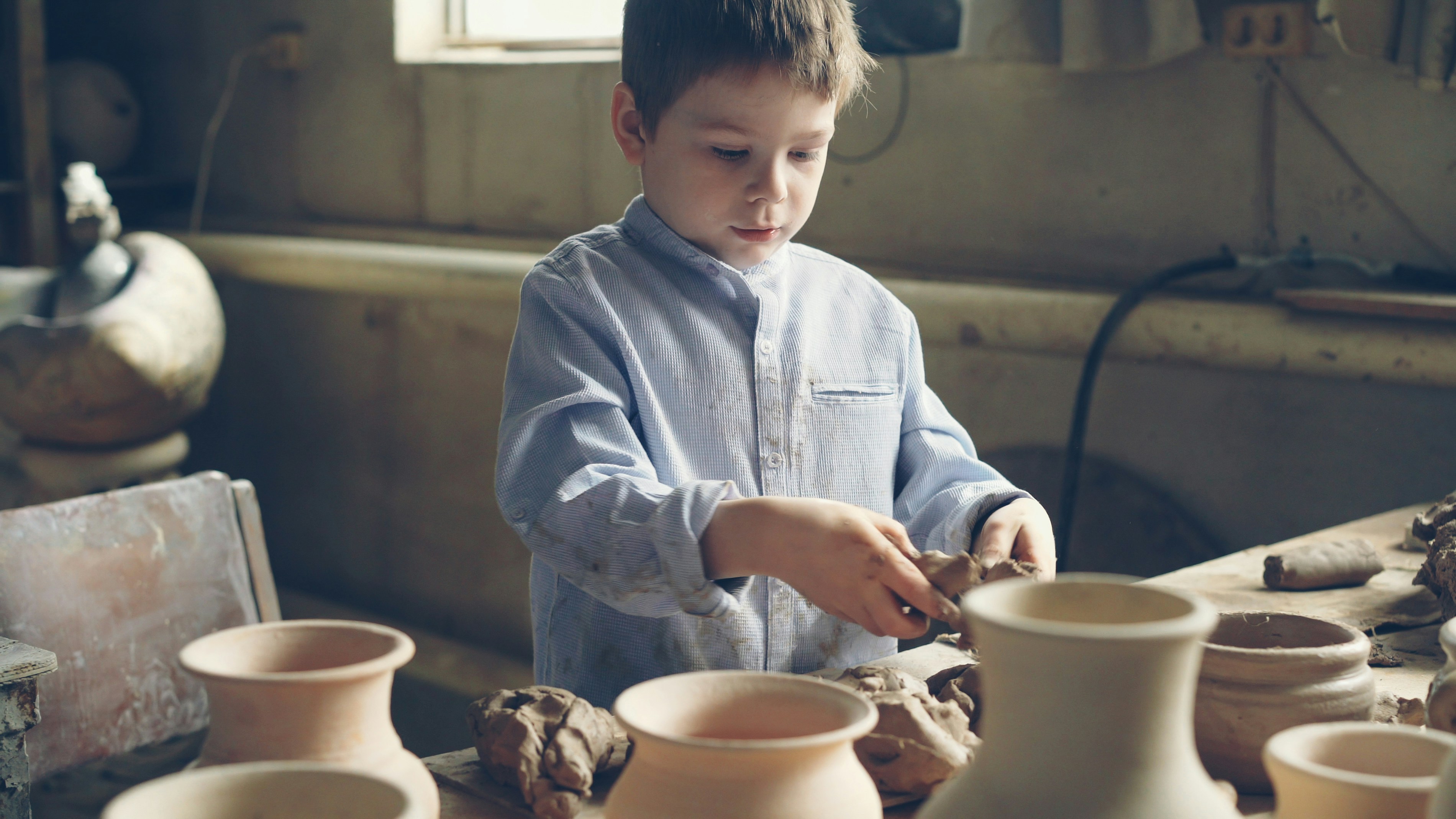 Boy playing with clay