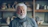 A smiling, older potter in his workshop.