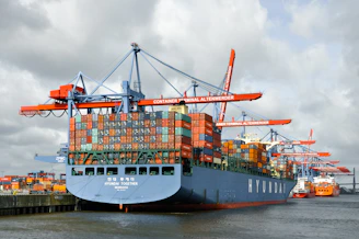 A cargo ship is docked at the port.