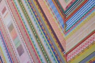 Colorful, striped fabric with various patterns and angles.