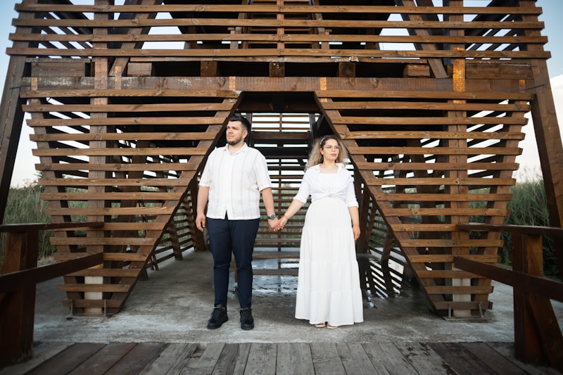 Holding hands under arch