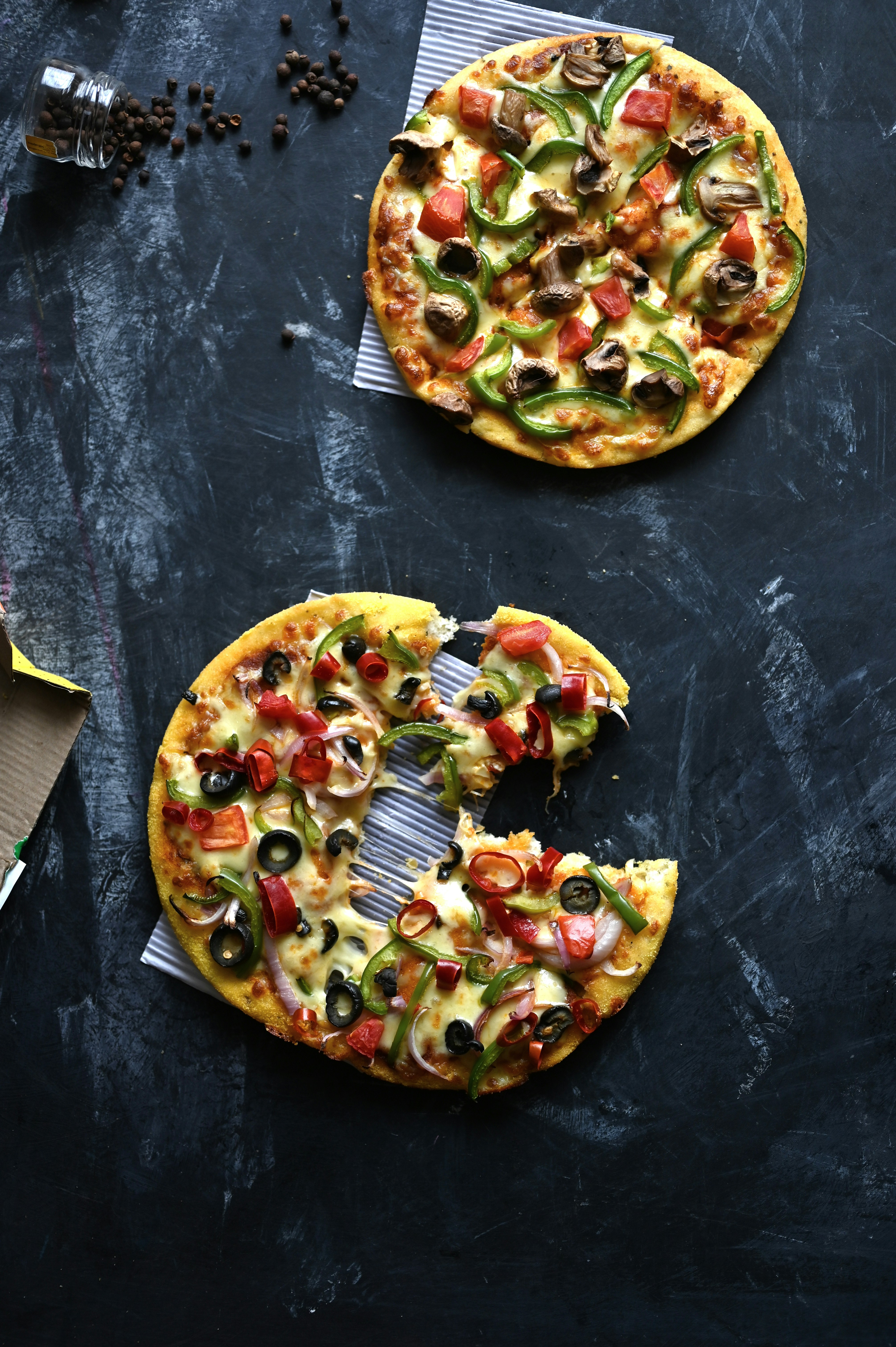 Two delicious pizzas are ready to be eaten!