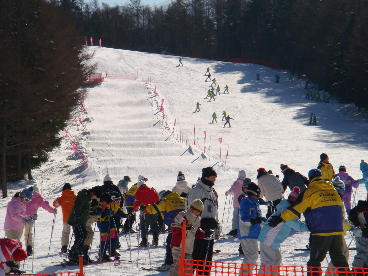 Skiers gathering on an active snow-covered slope representing Blue Mountain Resort