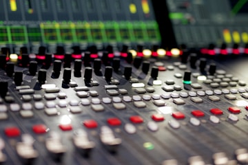 Mixing console with lights and knobs.