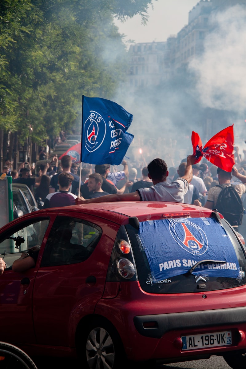 soccer stadium, football players, national flags, crowd celebrating, goal celebration