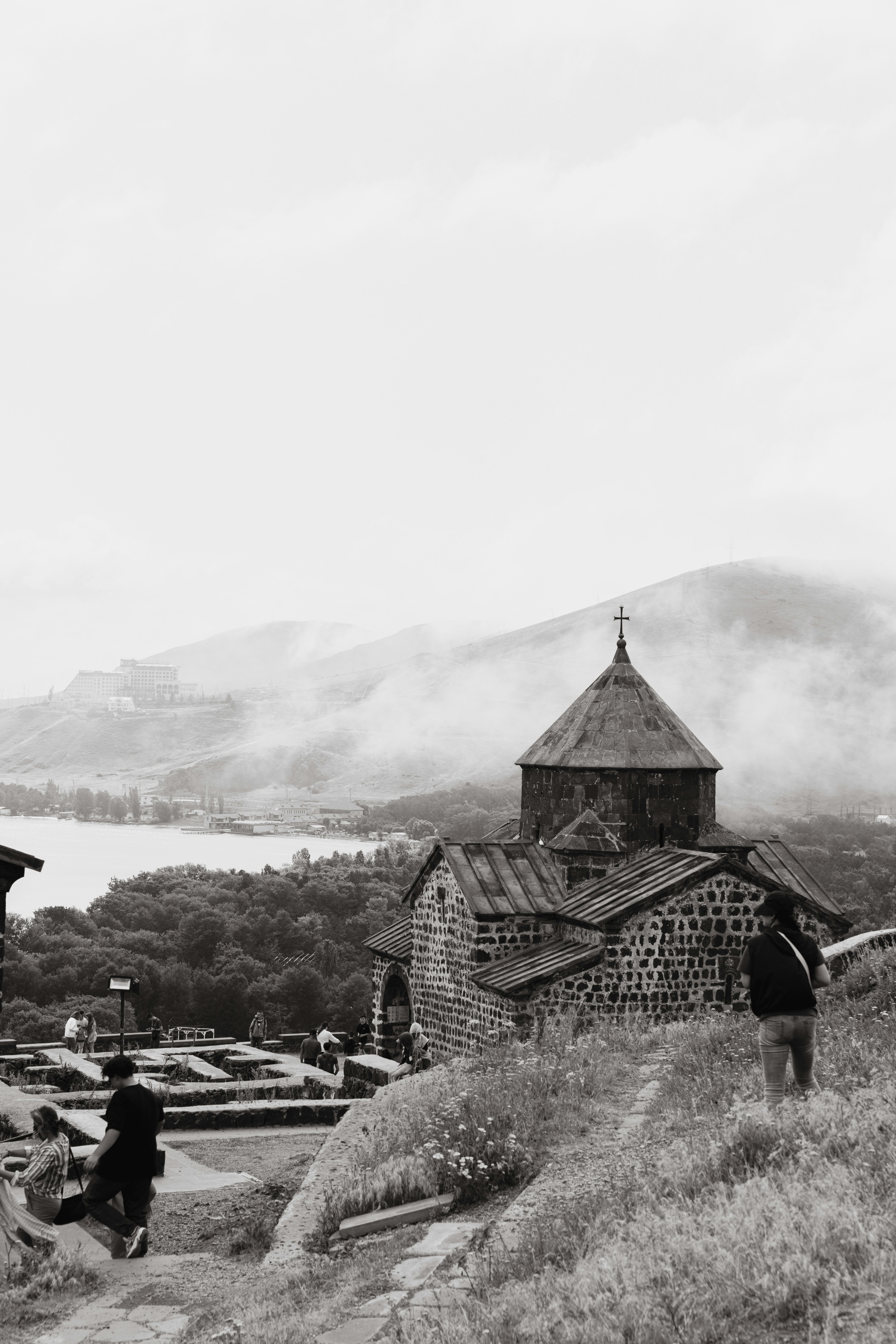 An ancient church sits high on a hillside.