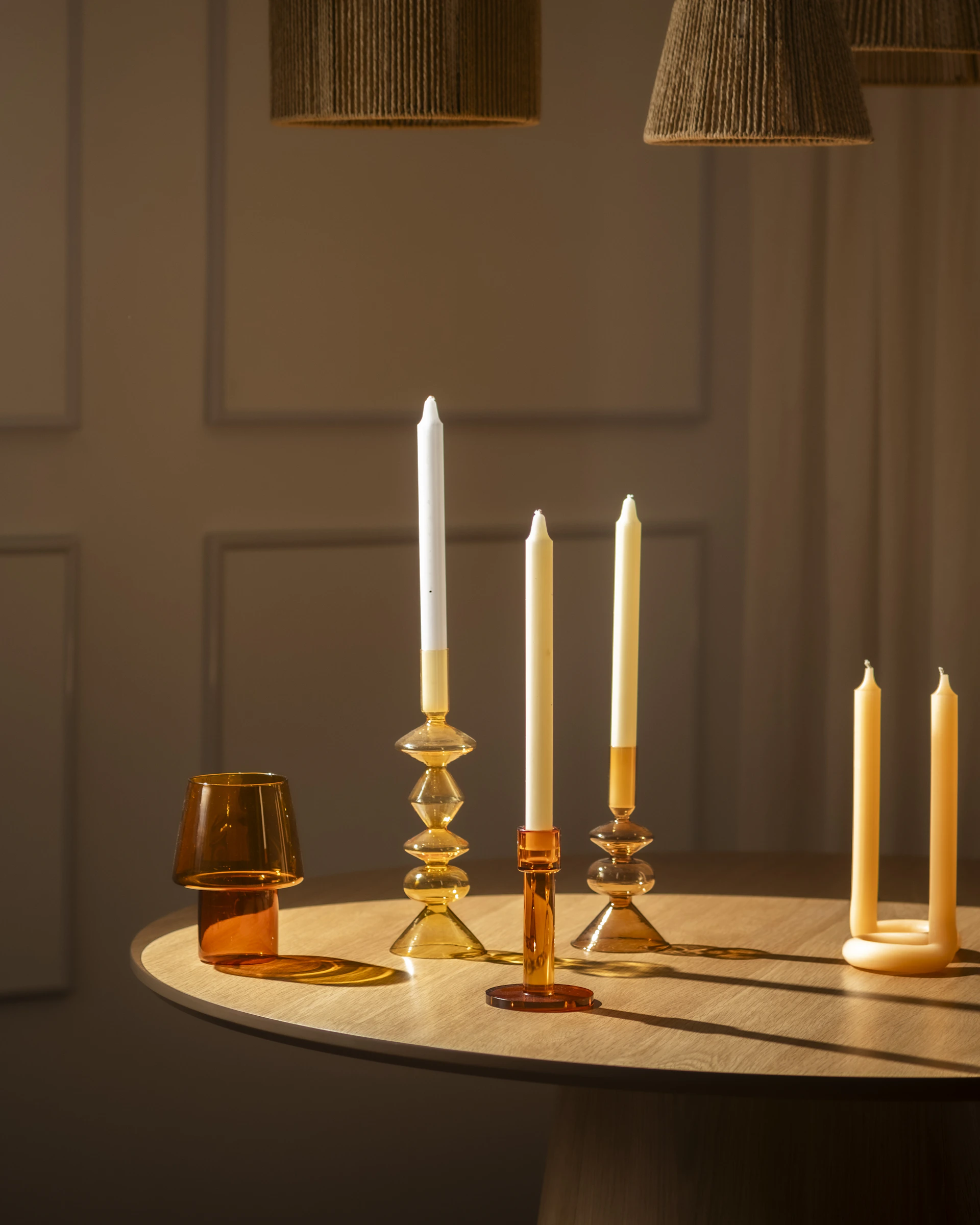 Candles and decor are arranged on a table.