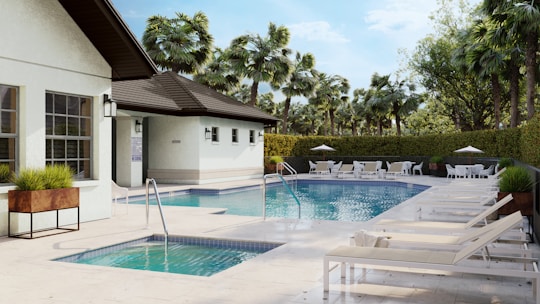 A beautiful pool and spa surrounded by landscaping.