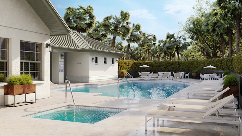 A pool area with loungers and palm trees