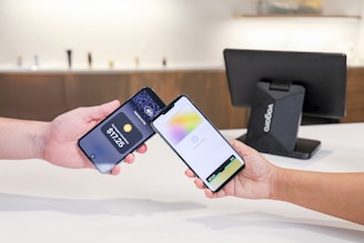 Two phones are used for contactless payment.