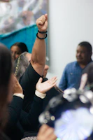 A person raises their fist in celebration.