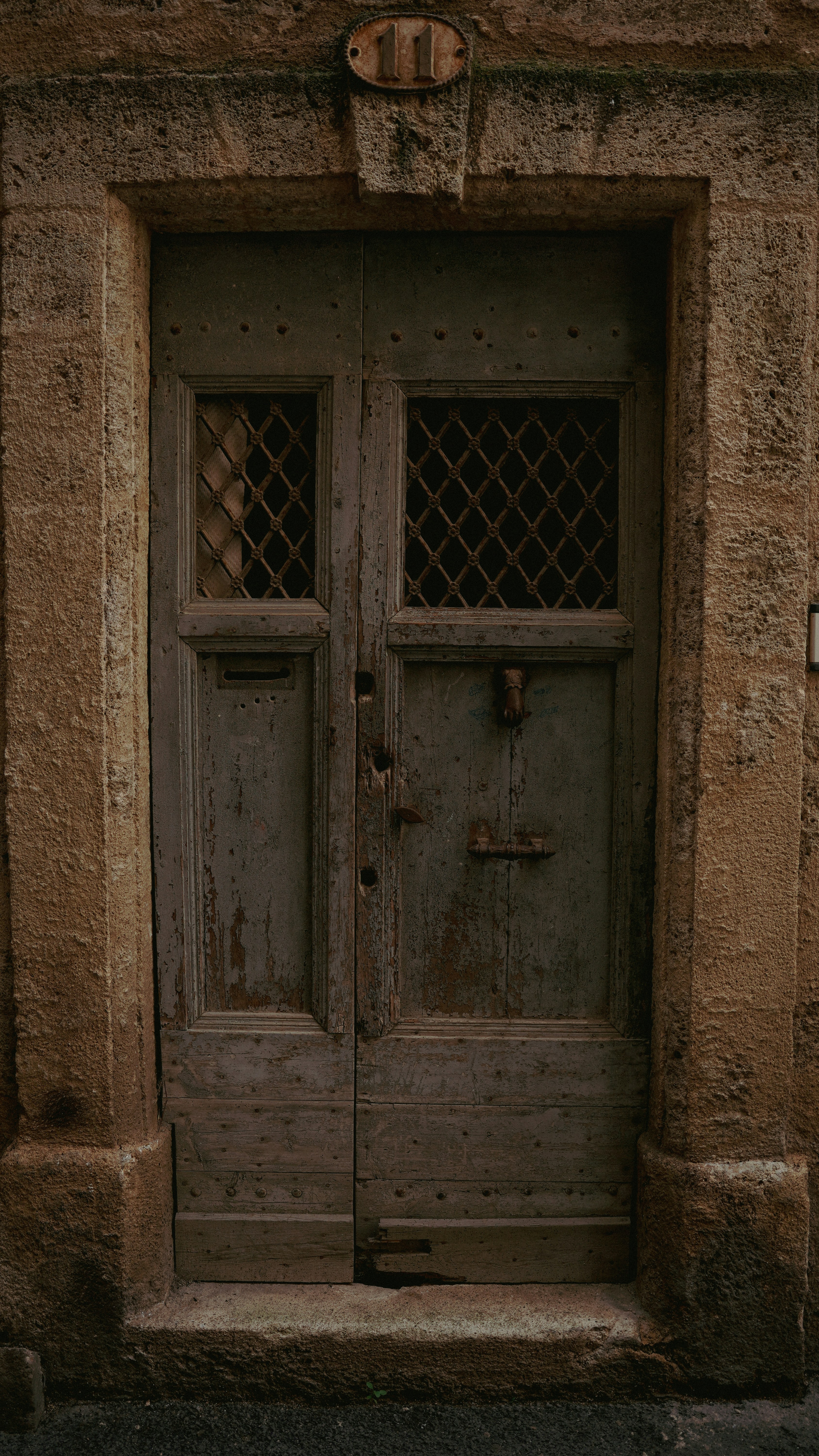 A weathered, aged wooden door.