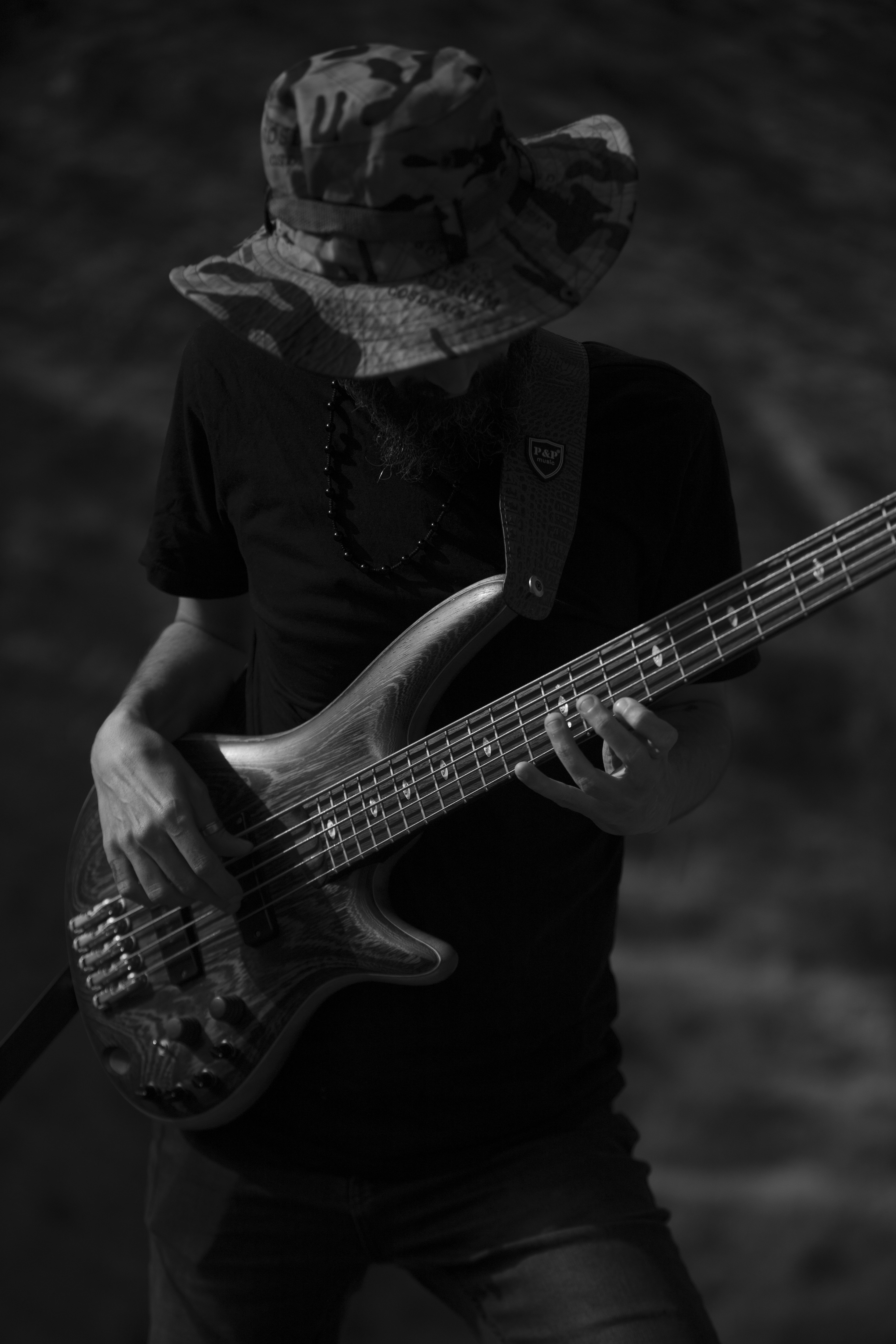 A musician plays a bass guitar.