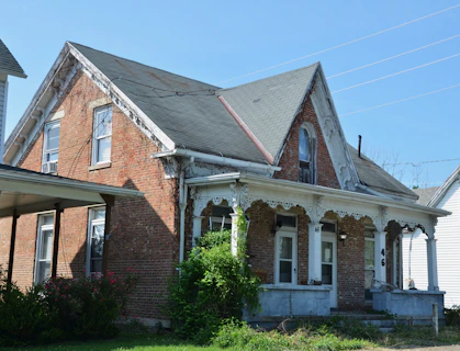 Old brick house with a covered porch