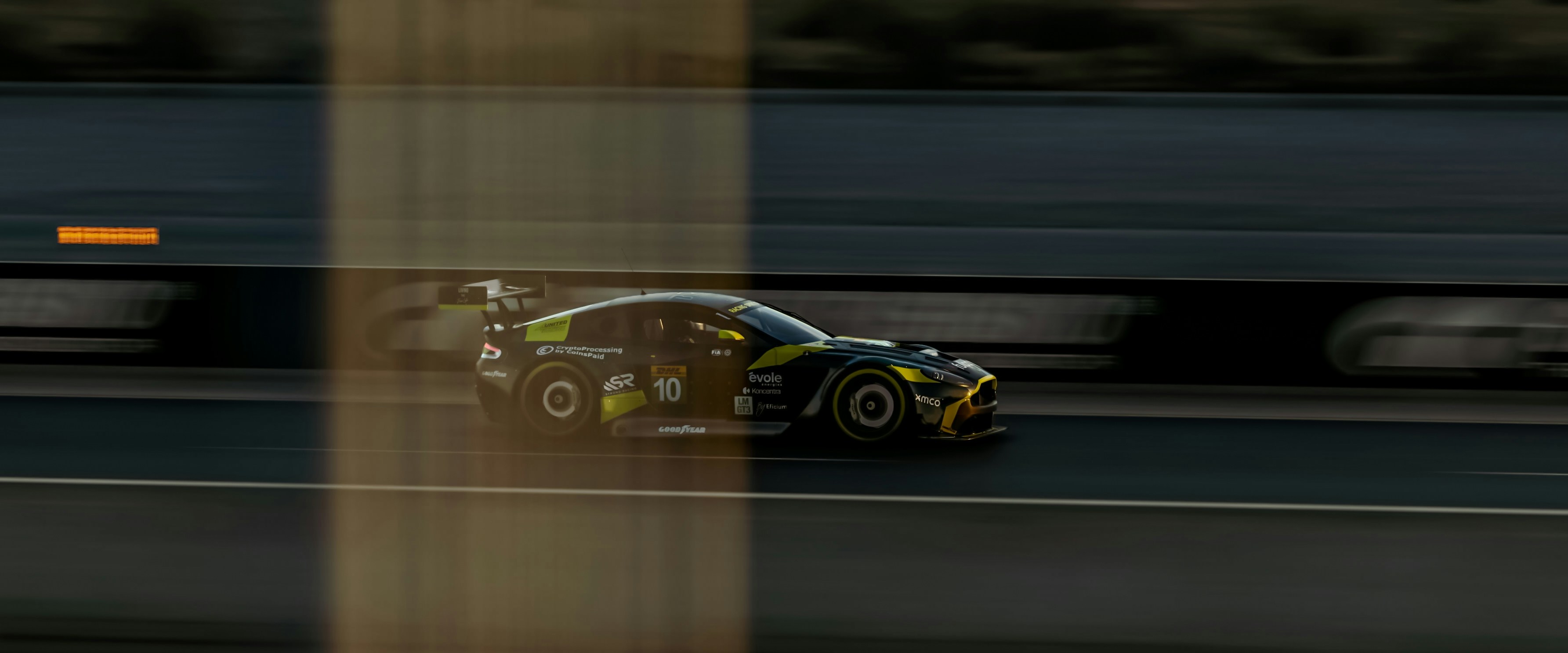 Race car speeding around the track.