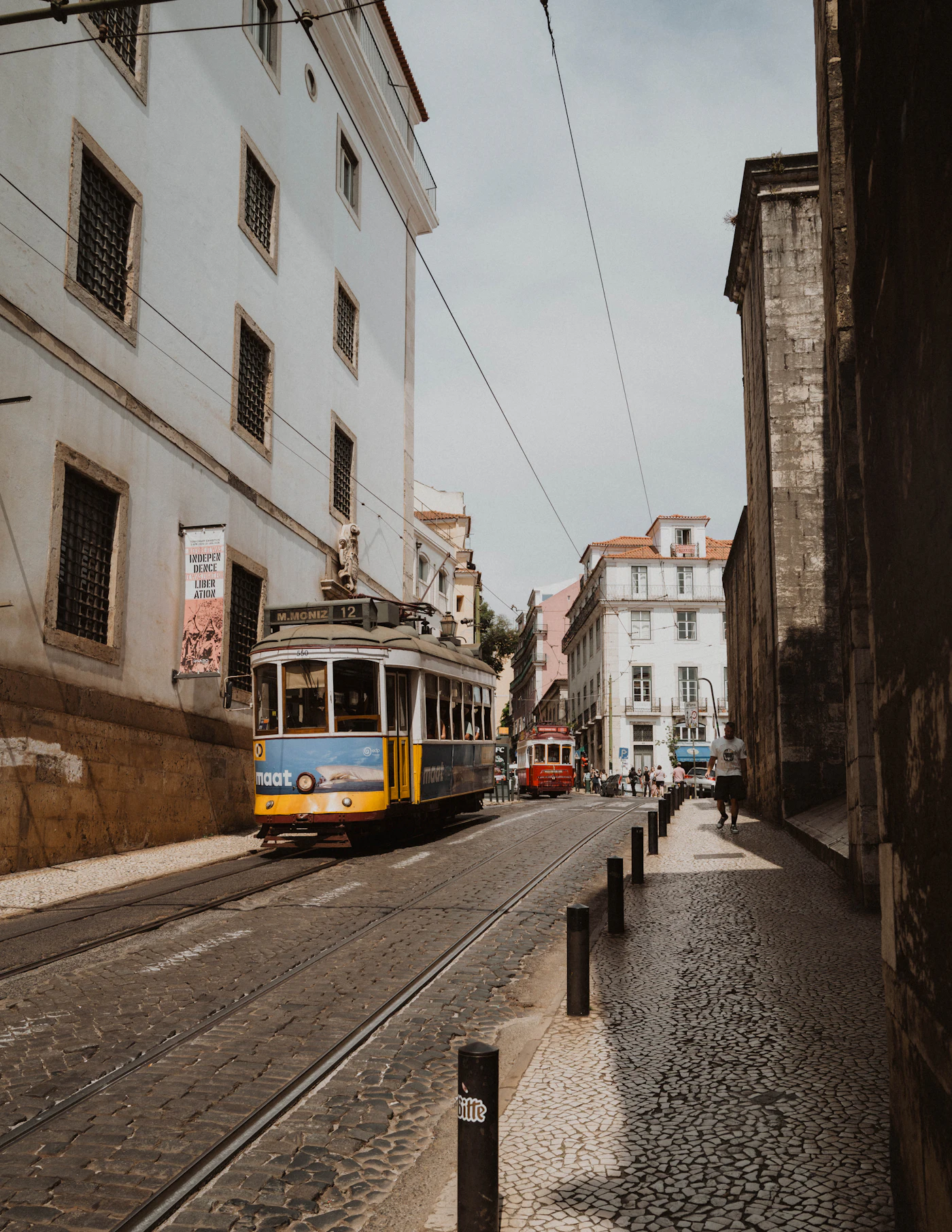 Yellow tram on a Lisbon street