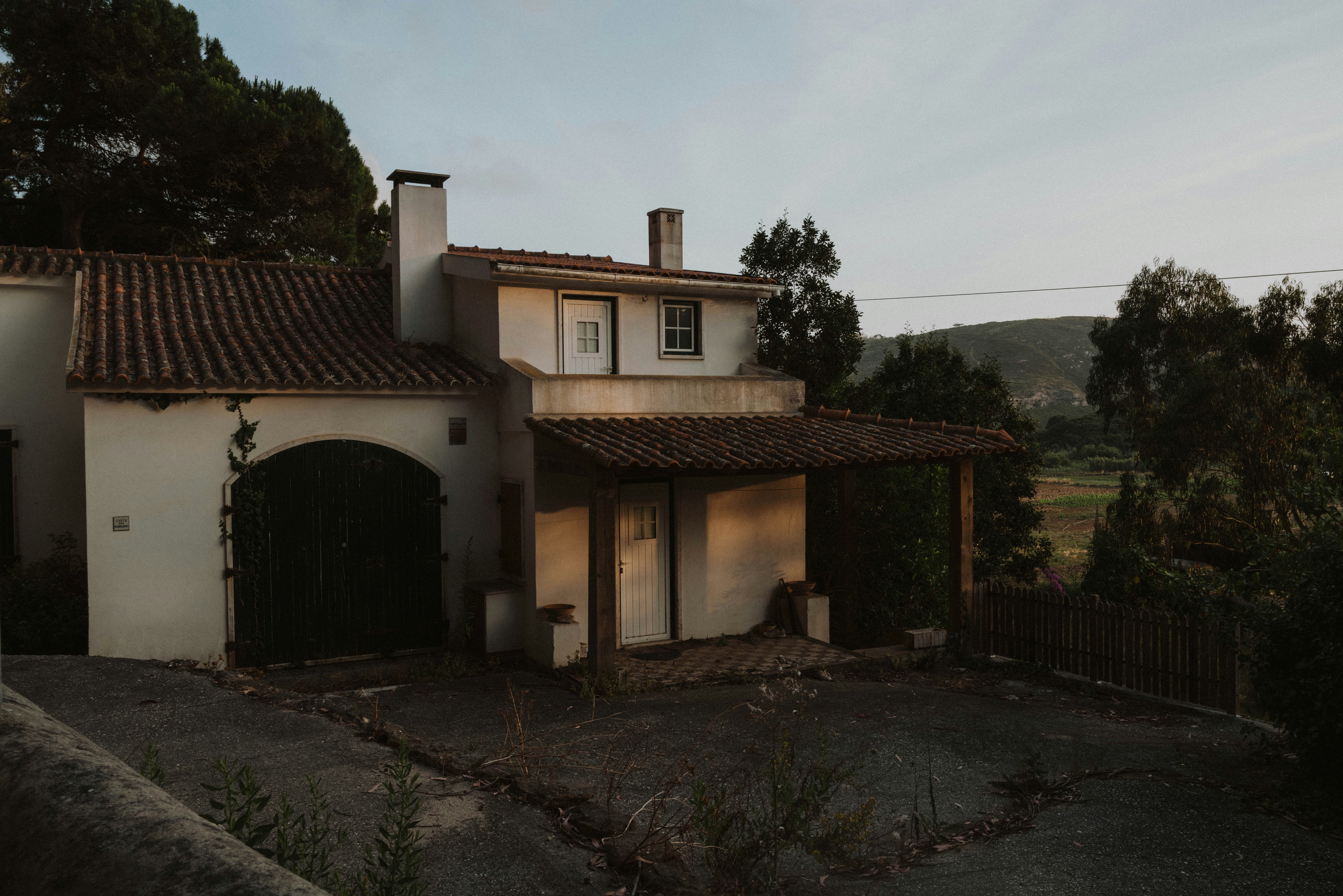 A rustic home sits nestled among the trees.