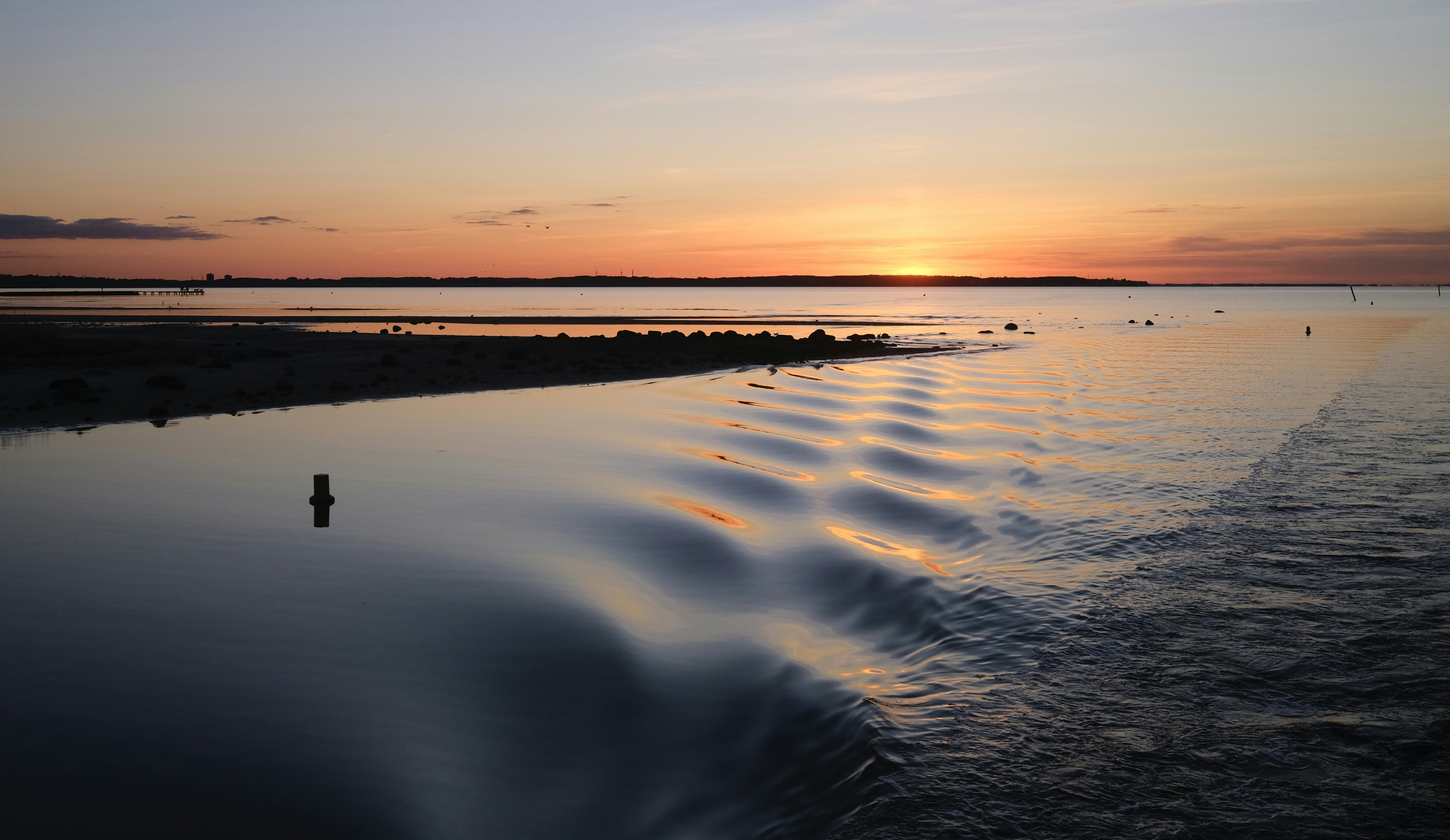 Beautiful sunset over calm water.