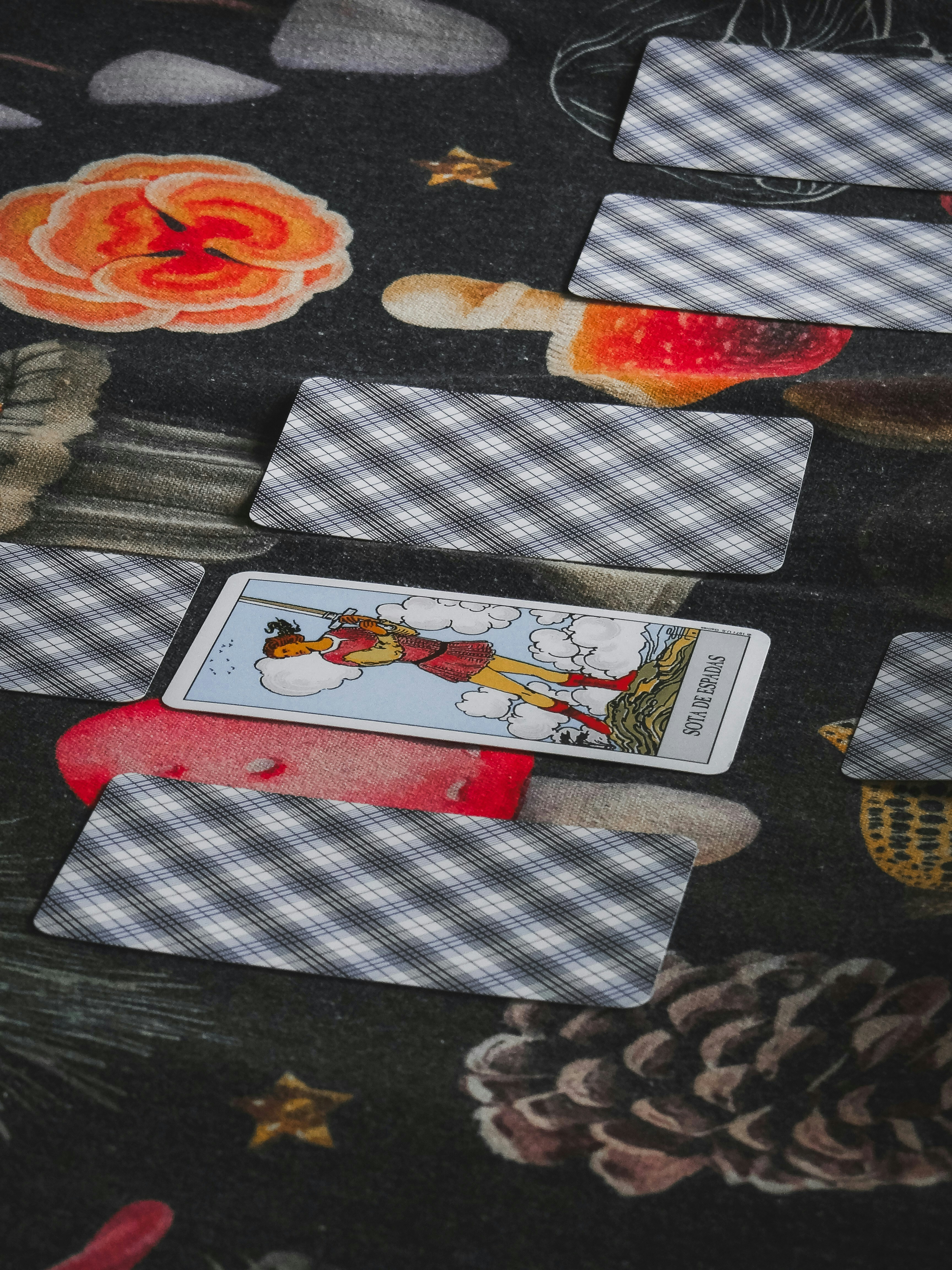 A tarot card reading is in progress.
