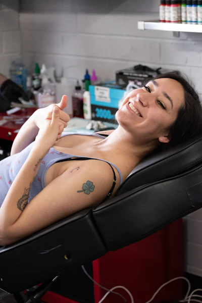 Client giving a thumbs up after a session