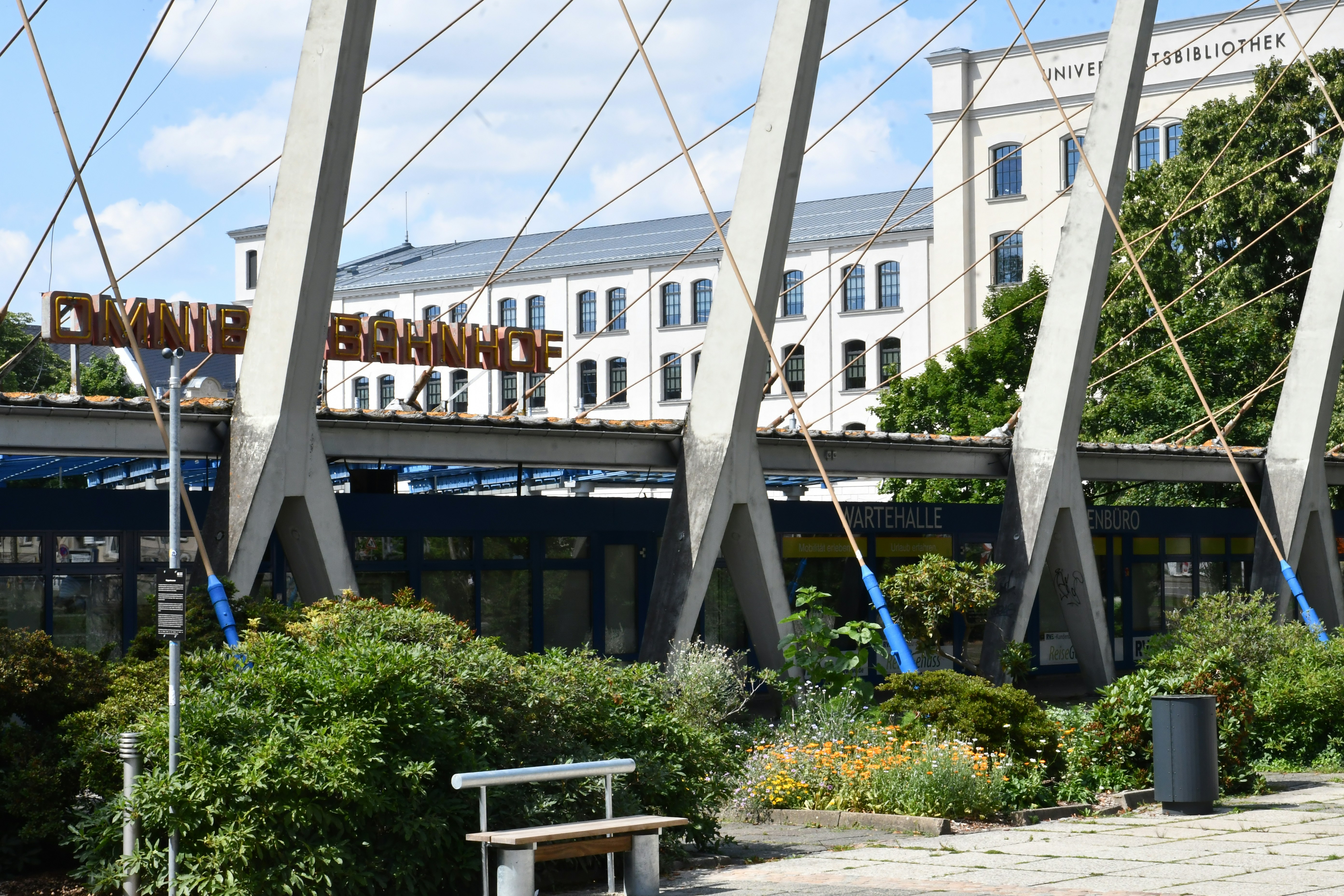 The image shows the entrance to a train station.