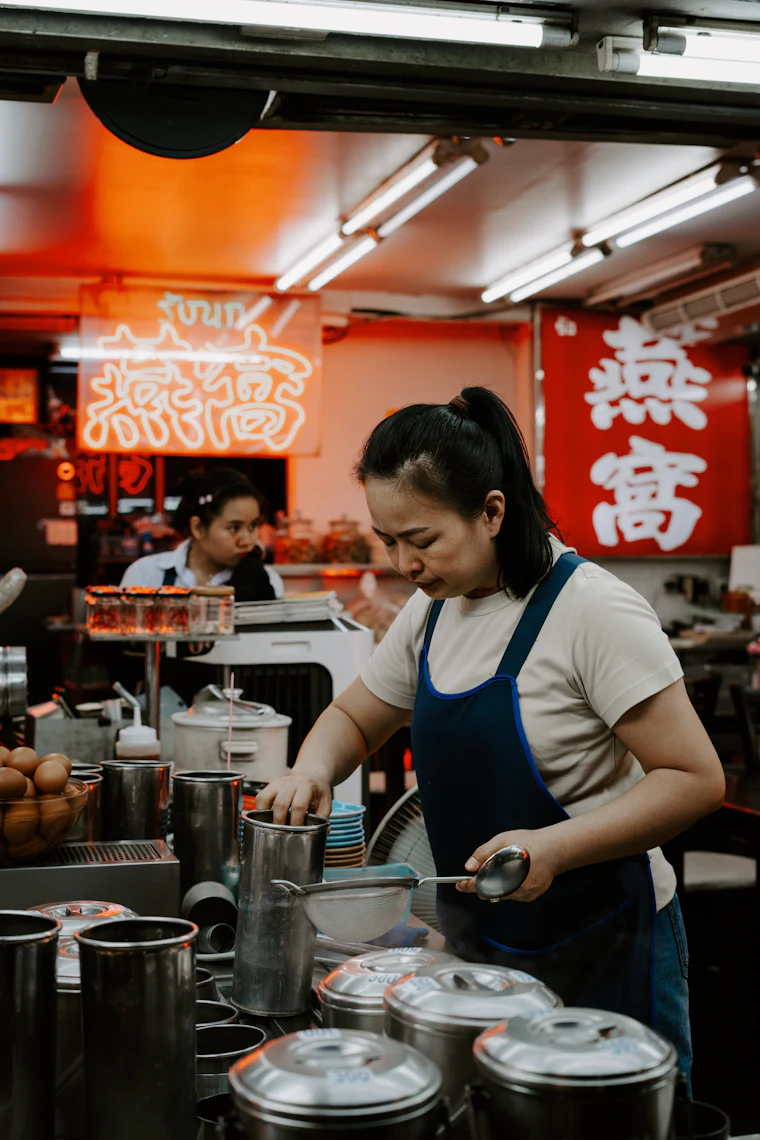 A busy commercial kitchen and service counter