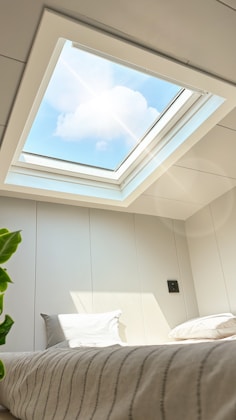 Bright sunlight pours in through the skylight.