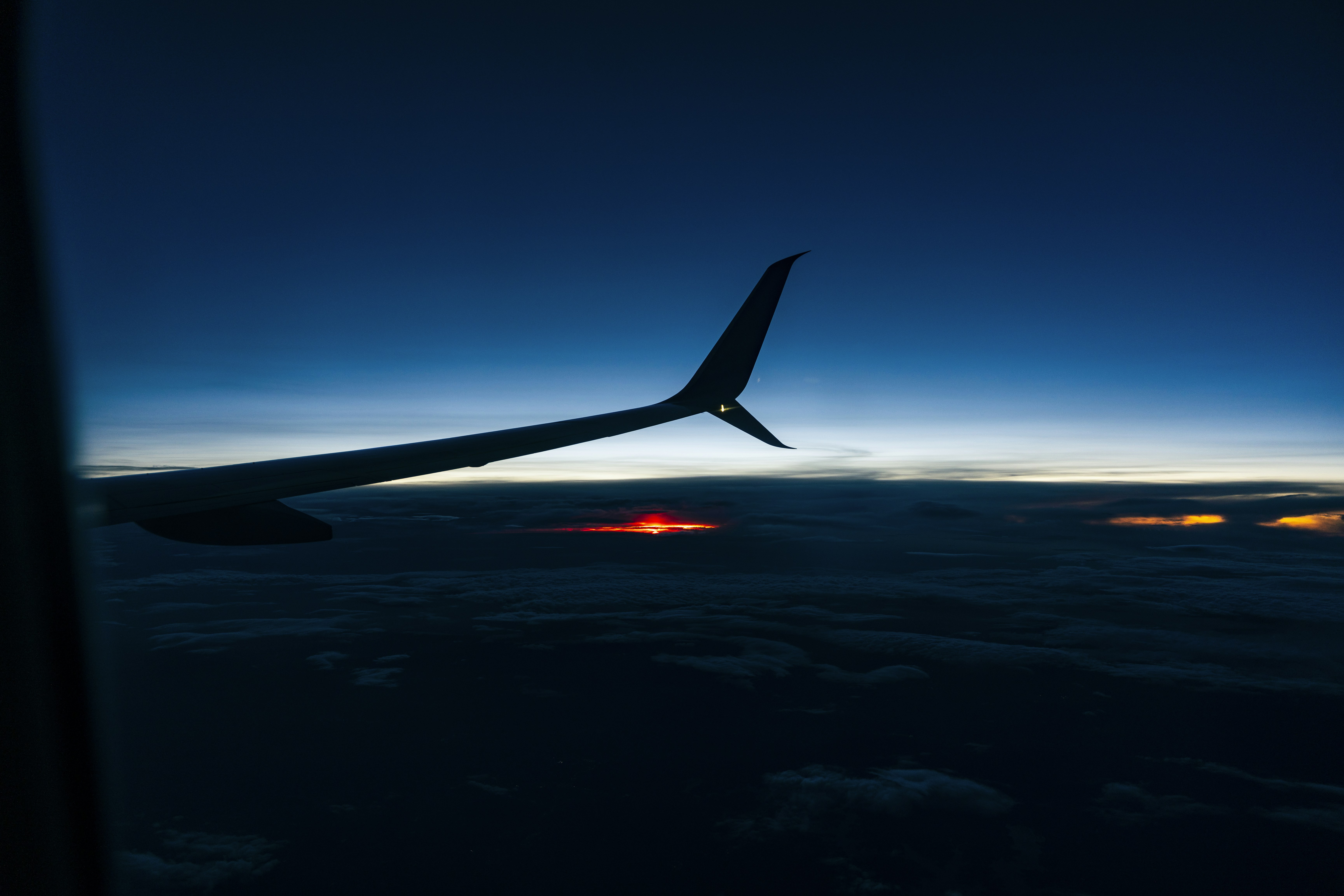 Airplane wing at dawn or dusk.