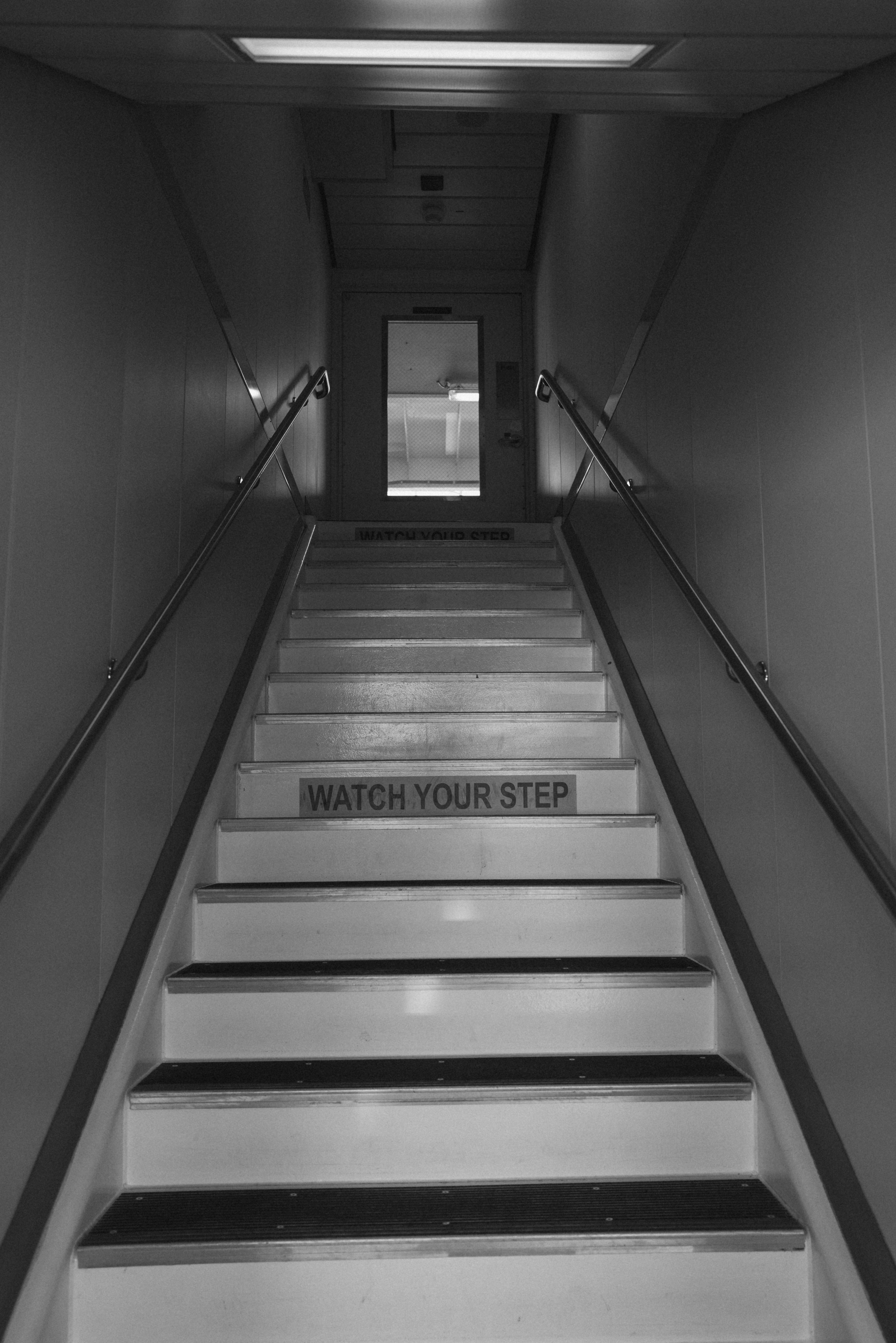 A staircase leads toward a door at the top.