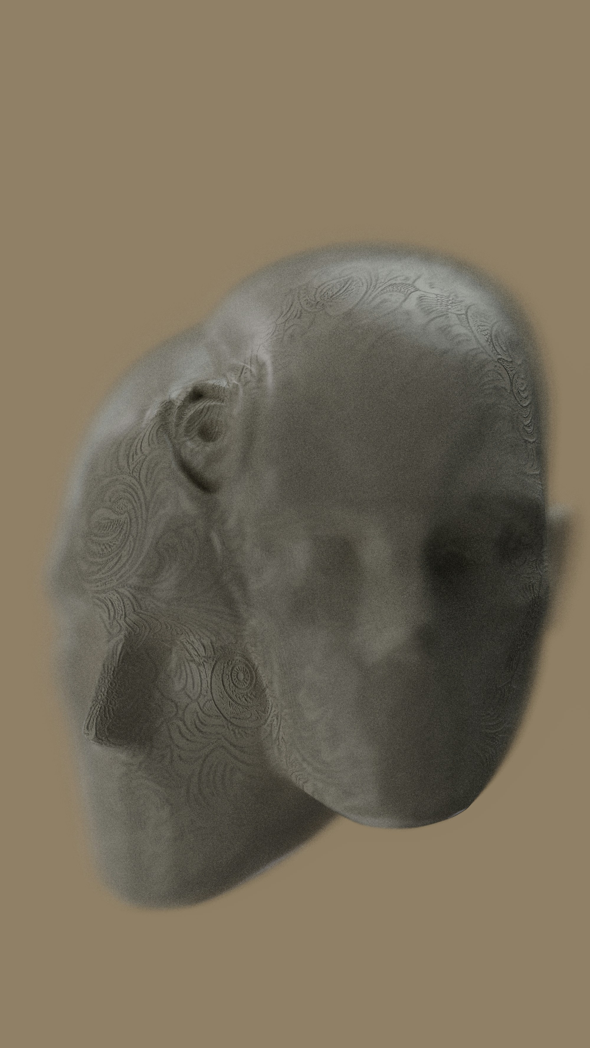 A stone head with floral patterns.