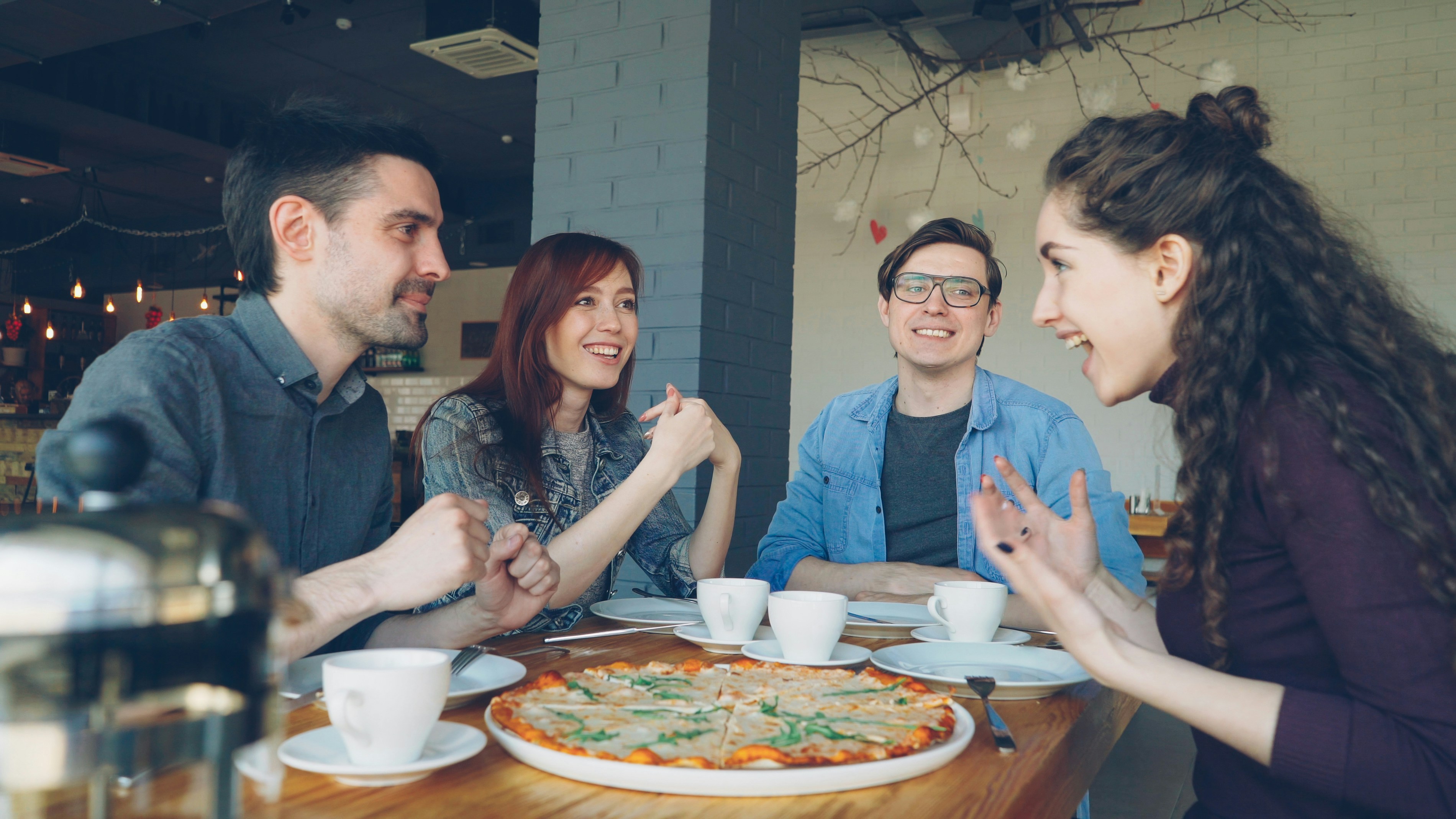 employees happily networking over a delicious catered lunch - corporate meeting catering