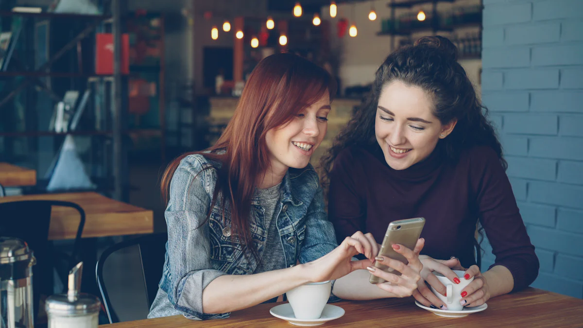Two young friends look together at a phone screen, sharing a shopping recommendation.