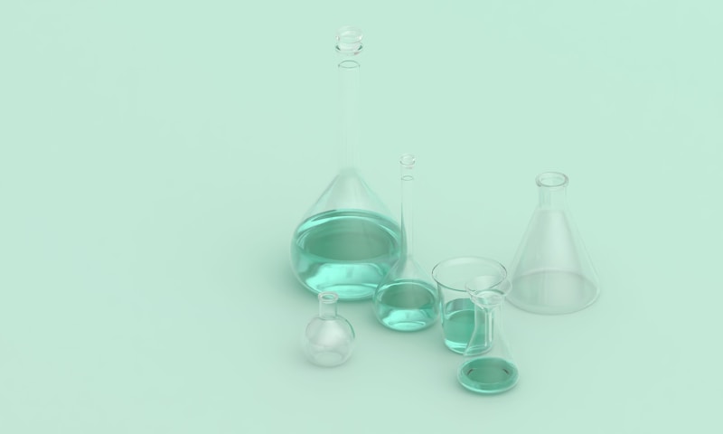 Laboratory beakers and flasks filled with chemical solvents including xylene