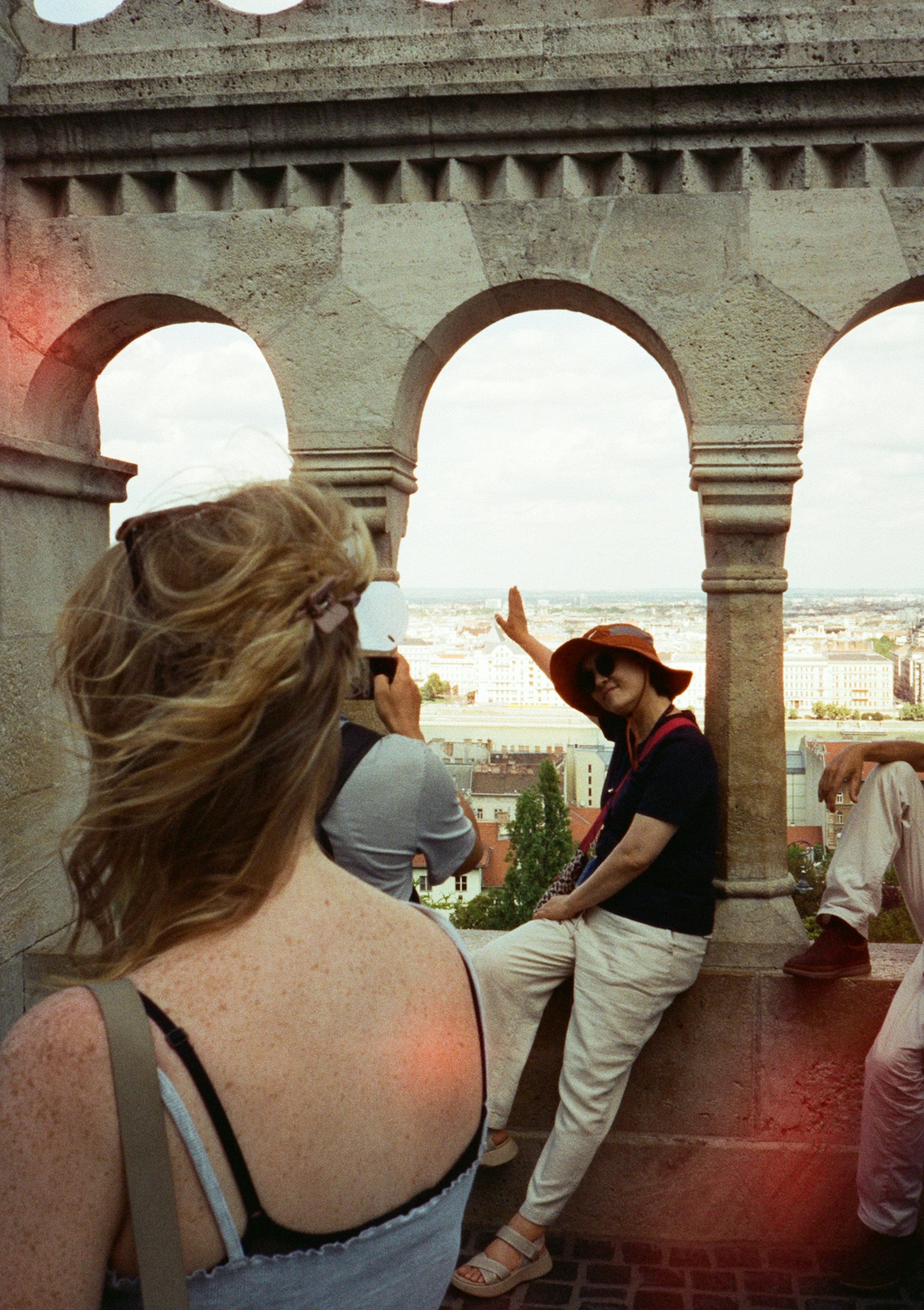 People enjoy the view from arched architecture