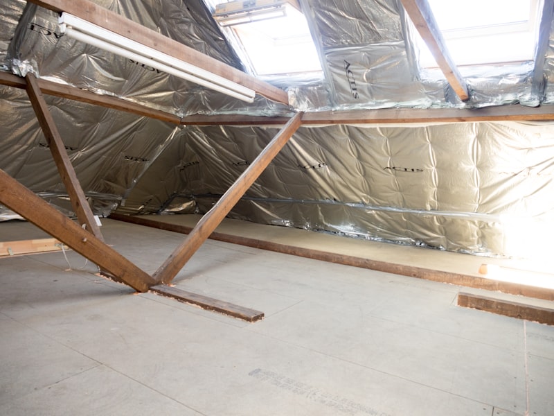 Insulated attic space with wooden structural beams and skylights