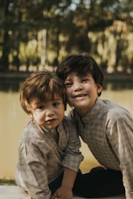 Two young brothers pose happily for a photo.
