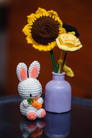 A crochet bunny and flowers brighten the scene.