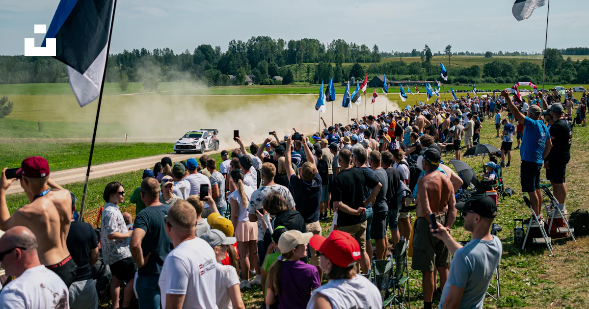 Modern Rally Spectators Rally car speeds past excited spectators. photo – Free Car Image on ...