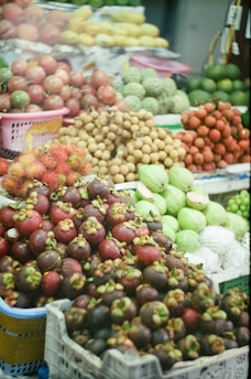 Fresh, colorful fruits are for sale at a market.