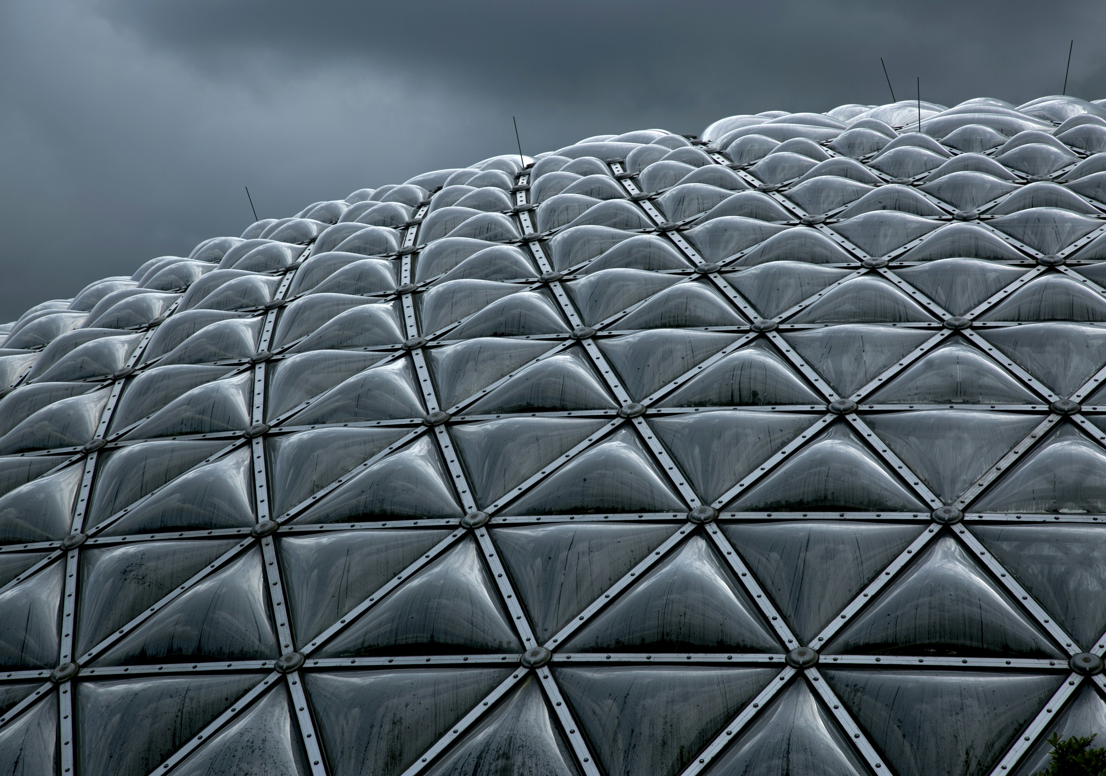 A dome's geometric exterior under dark skies.