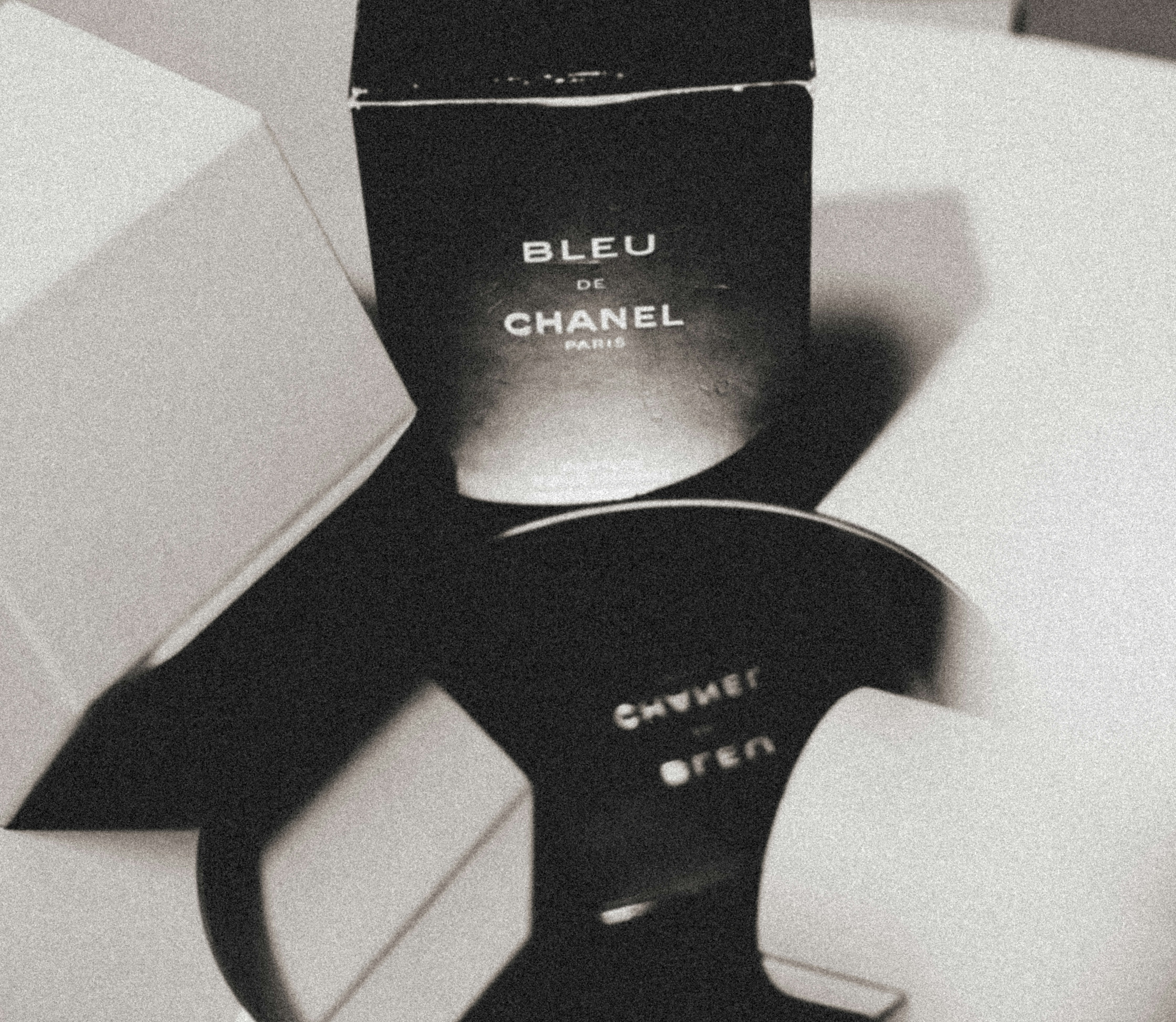 Bleu de chanel perfume box displayed on a surface.