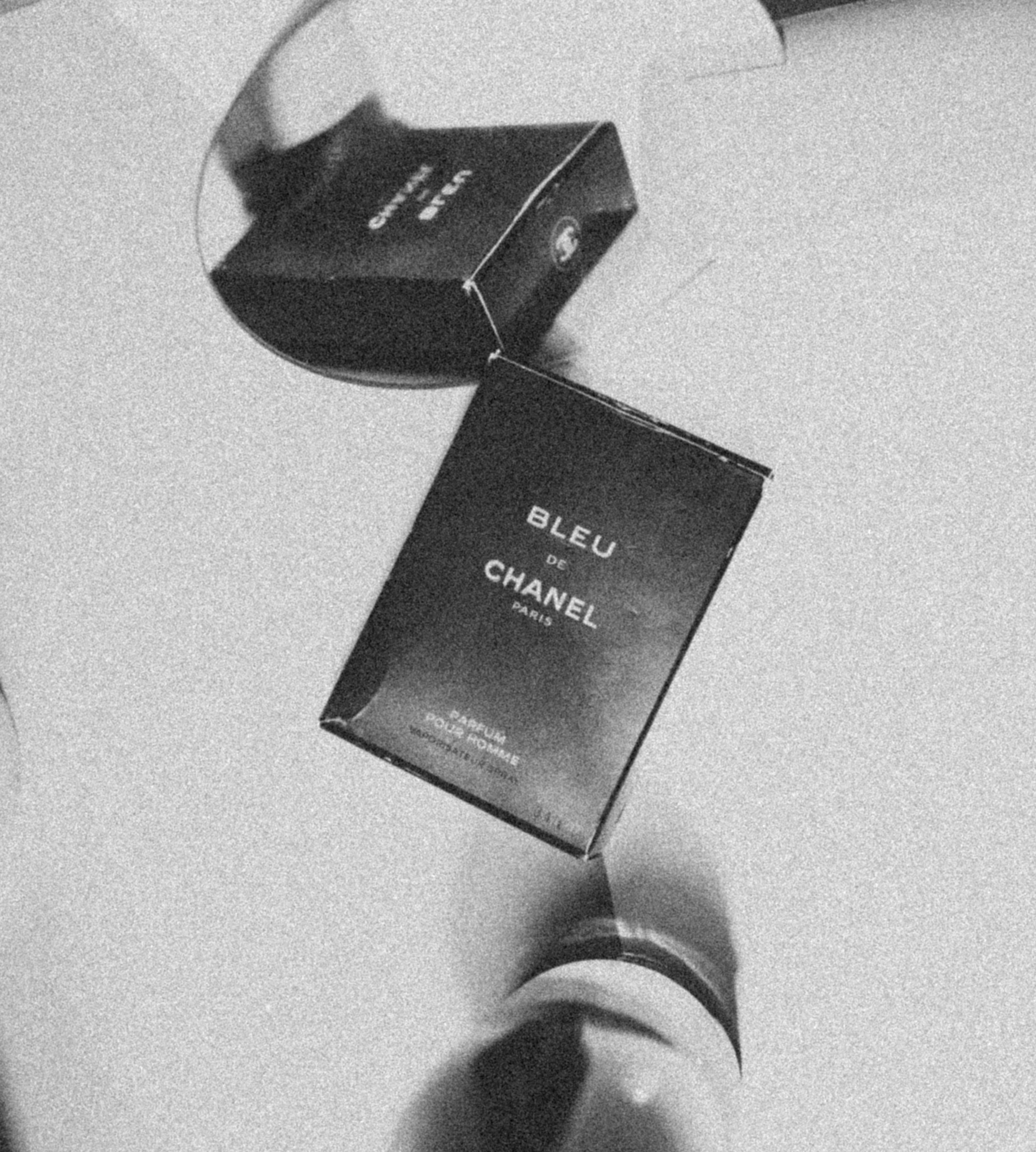 Two boxes of chanel bleu perfume rest.